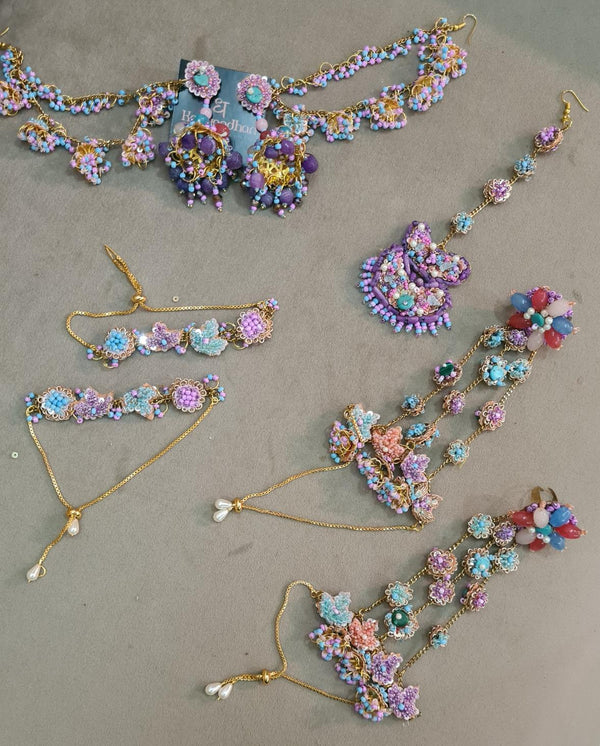 Assorted Pastels Jewelry Collection with Floral Motifs, Delicate Beadwork, and Tassel Accents