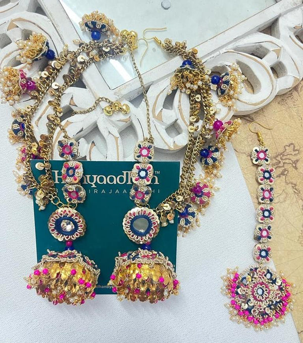 Gold-Tinged Ensemble with Vibrant Pink and Blue Gemstone Embellishments and Delicate Tassel Details