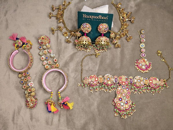 Elegant Necklaces, shop-by-style, shop-by-vibe and Earrings Set, Adorned with Multicolored Gemstones, Paired with Tassel-Embellished Bangless and a Radiant Maang Tikka.
