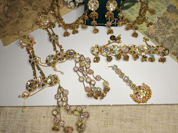 Exquisite Ensemble FeaturingEarrings, Elaborate Necklaces, shop-by-style, shop-by-vibe, and Adorned Hairpieces, All Crafted with Sparkling Gemstones and Detailed Floral Patterns.